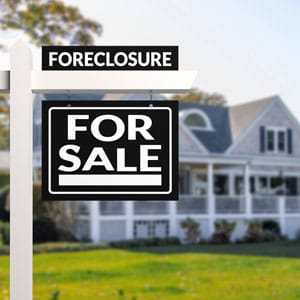 A foreclosure sign in front of a house - THE LAW OFFICES OF DIANE ANDERSON